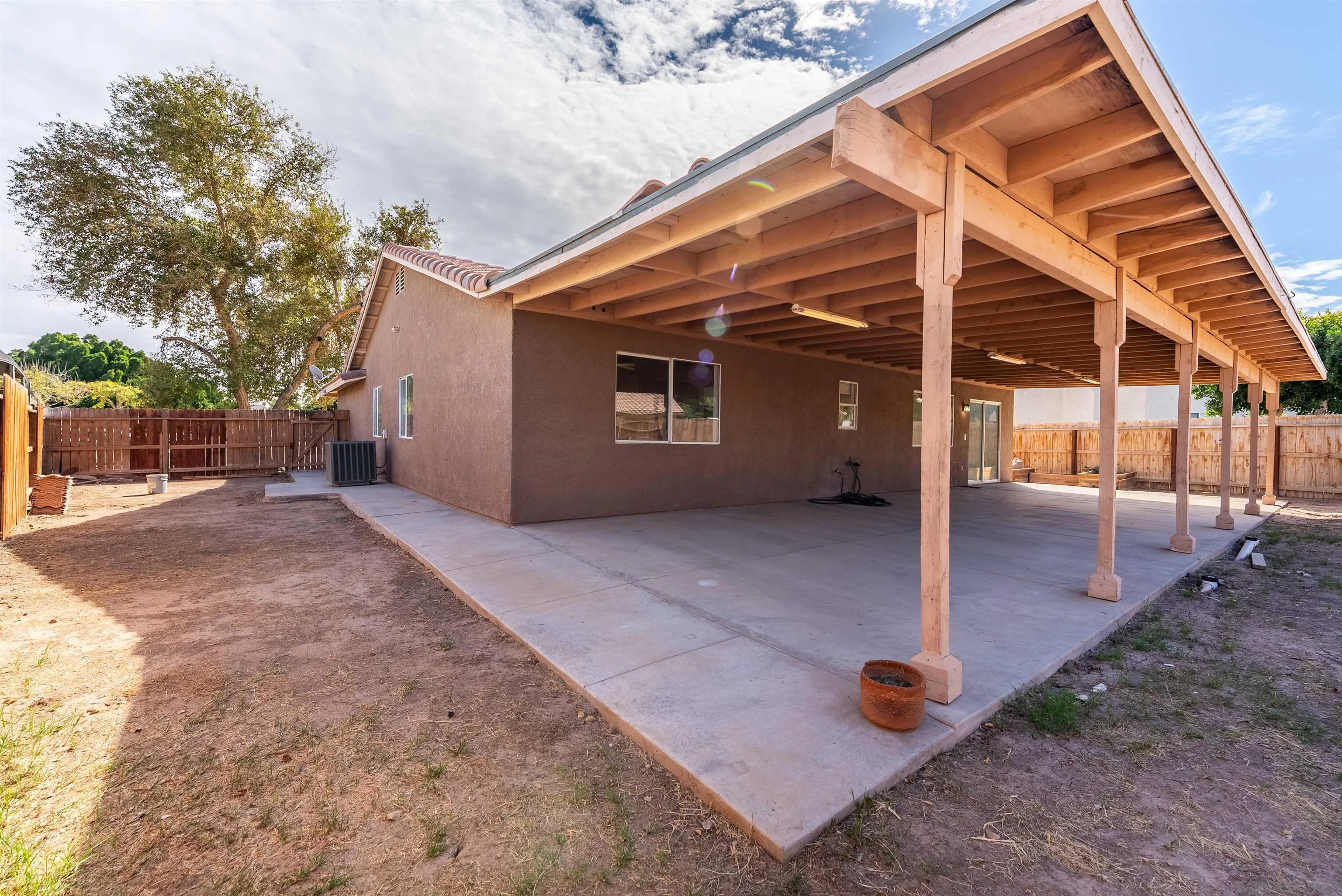 931 Jones Street Brawley, CA 92227 - Photo 11 of 17 a view of a house with backyard and a tree