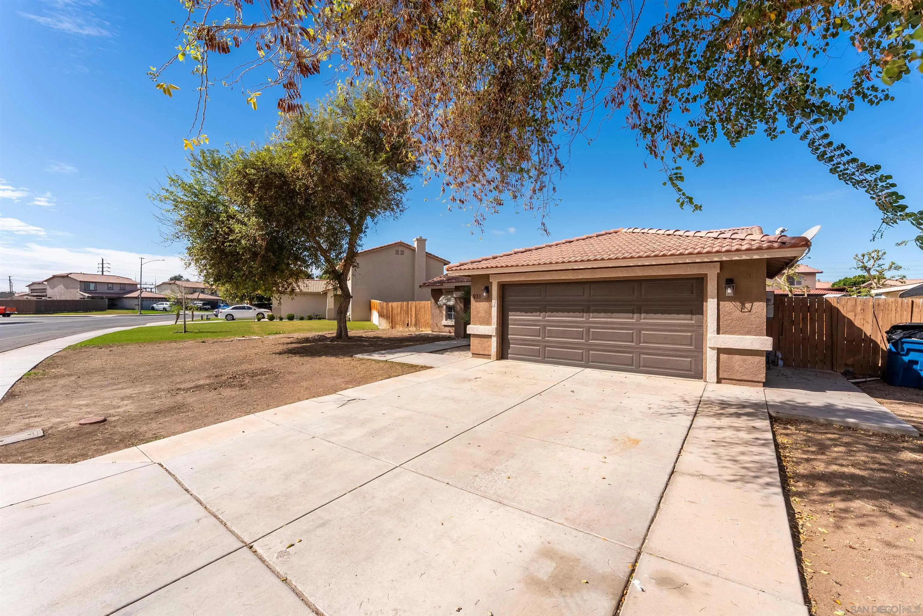 931 Jones Street Brawley, CA 92227 - Photo 3 of 17 a front view of a house with a yard