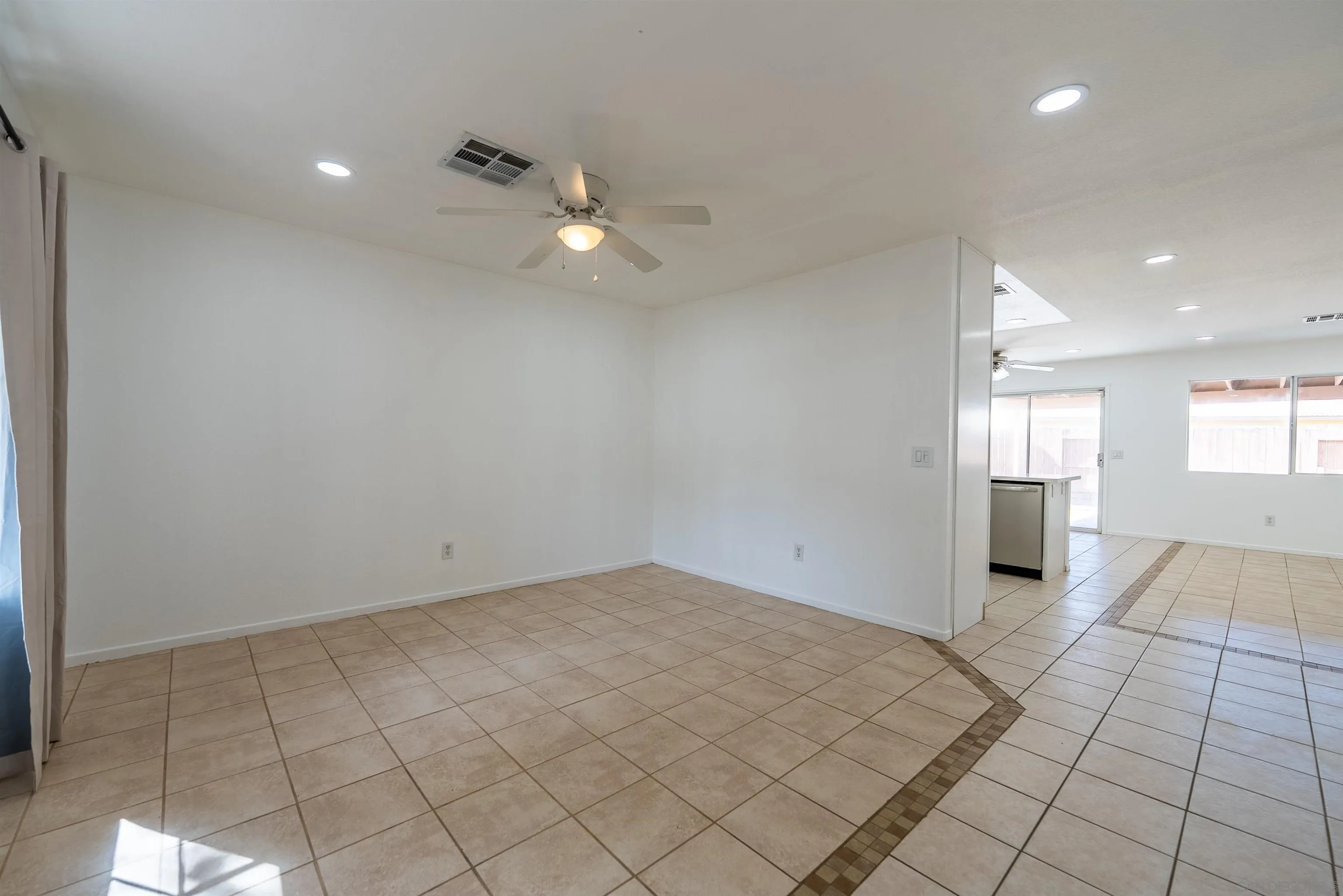 931 Jones Street Brawley, CA 92227 - Photo 4 of 17 an empty room with windows and entrance