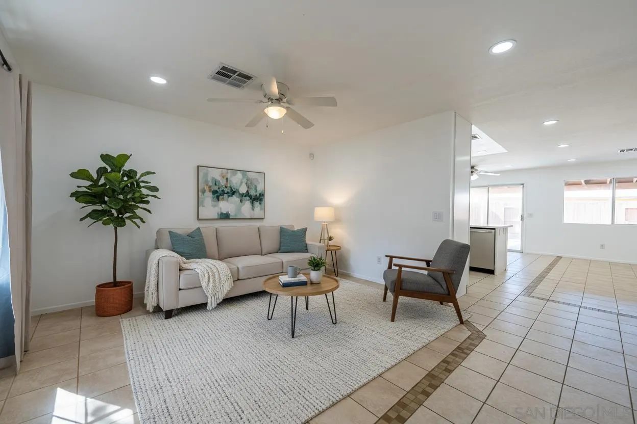 931 Jones Street Brawley, CA 92227 - Photo 5 of 17 a living room with furniture and a chandelier