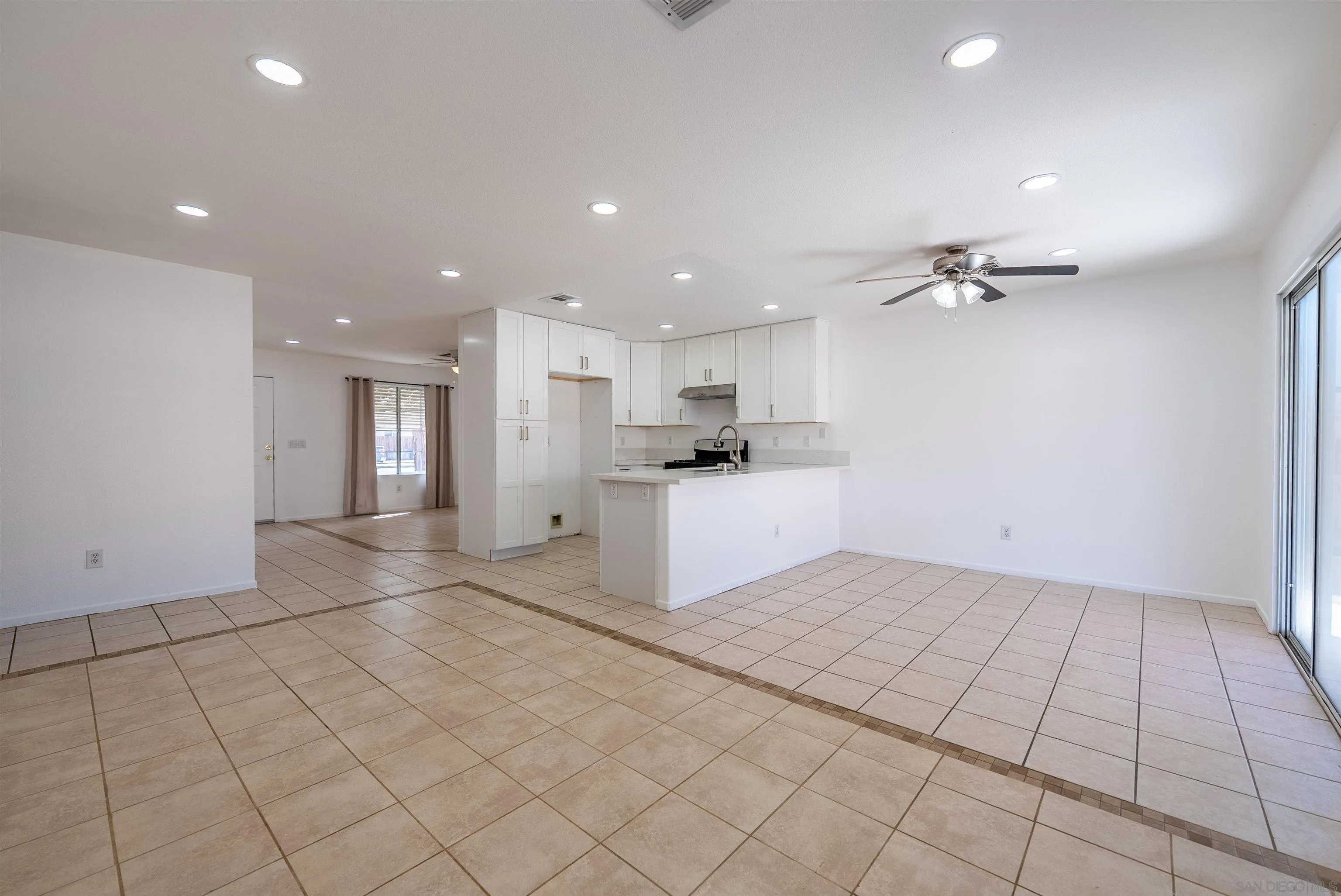 931 Jones Street Brawley, CA 92227 - Photo 6 of 17 a view of a kitchen with a sink and a refrigerator
