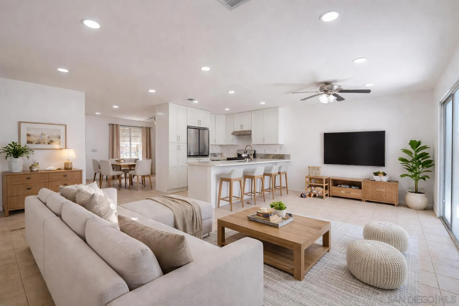 931 Jones Street Brawley, CA 92227 - Photo 7 of 17 a living room with furniture kitchen view and a flat screen tv