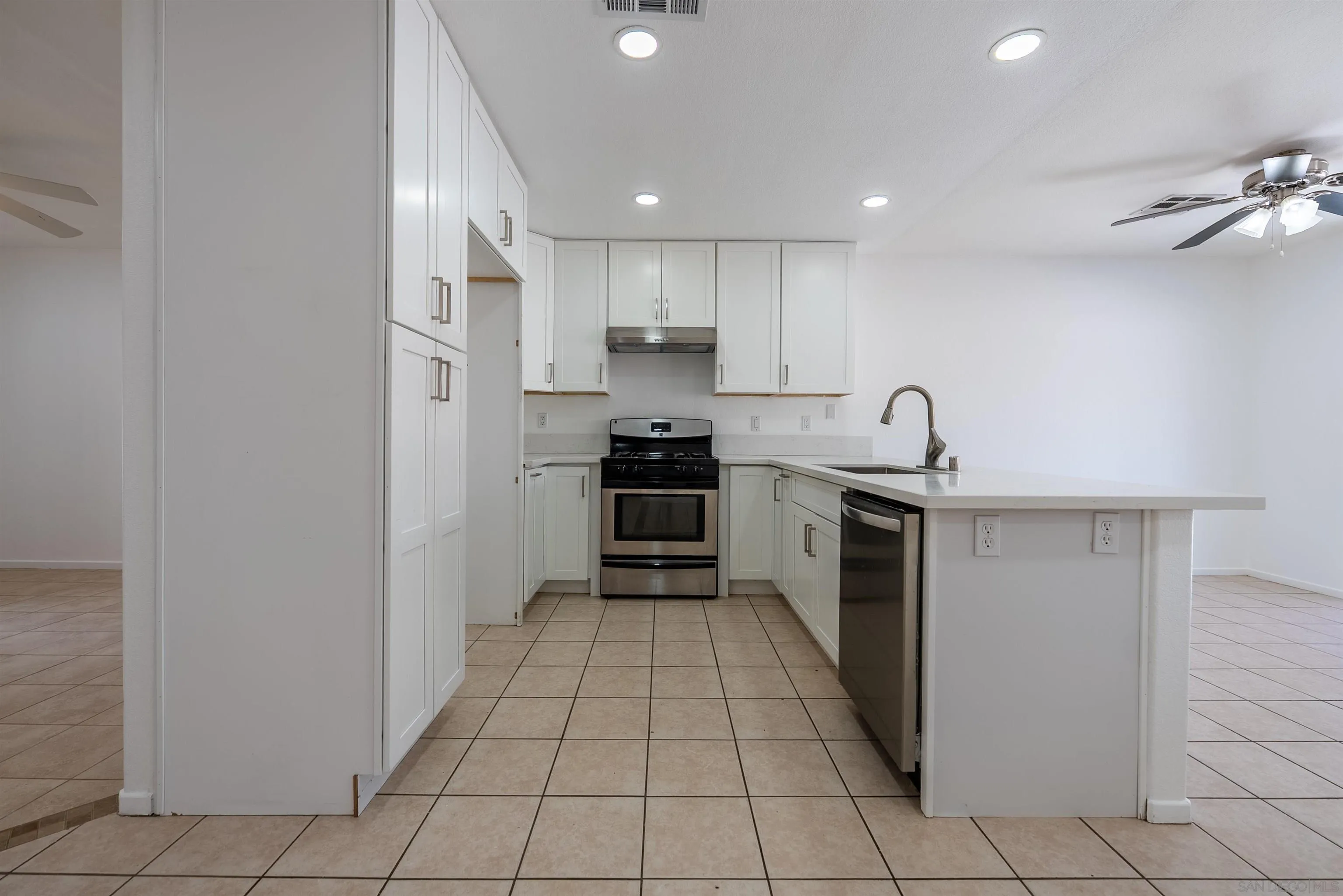 931 Jones Street Brawley, CA 92227 - Photo 8 of 17 a kitchen with stainless steel appliances granite countertop a sink and cabinets
