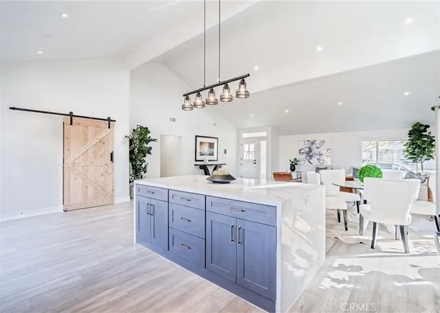 a view of a kitchen and dining room