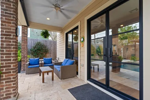 a patio with yard table and chairs