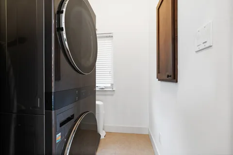 an aerial view of residential houses with city view
