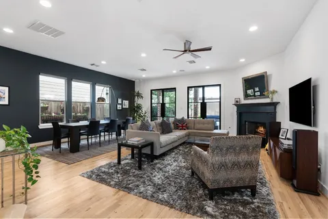 a view of a livingroom with furniture and a flat screen tv
