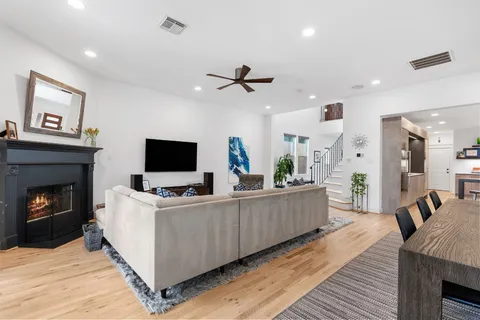 a large kitchen with a table and chairs