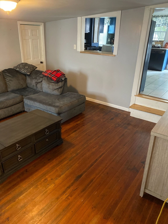 368 Globe Street Fall River, MA 02724 - Photo 11 of 31 a living room with furniture and a wooden floor