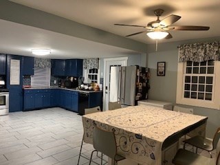 368 Globe Street Fall River, MA 02724 - Photo 14 of 31 a kitchen with kitchen island a cabinets counter space and stainless steel appliances