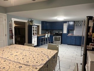 368 Globe Street Fall River, MA 02724 - Photo 15 of 31 a kitchen with stainless steel appliances kitchen island granite countertop a refrigerator oven a sink counter space and stainless steel appliances