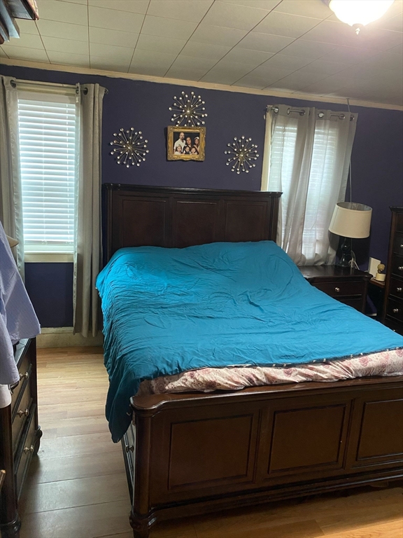 368 Globe Street Fall River, MA 02724 - Photo 16 of 31 a bed sitting in a bedroom next to a window