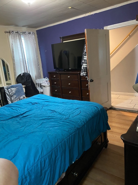 368 Globe Street Fall River, MA 02724 - Photo 17 of 31 a bed room with a bed and a television
