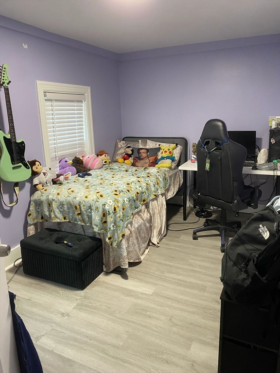 368 Globe Street Fall River, MA 02724 - Photo 20 of 31 a bedroom with a bed and wooden floor