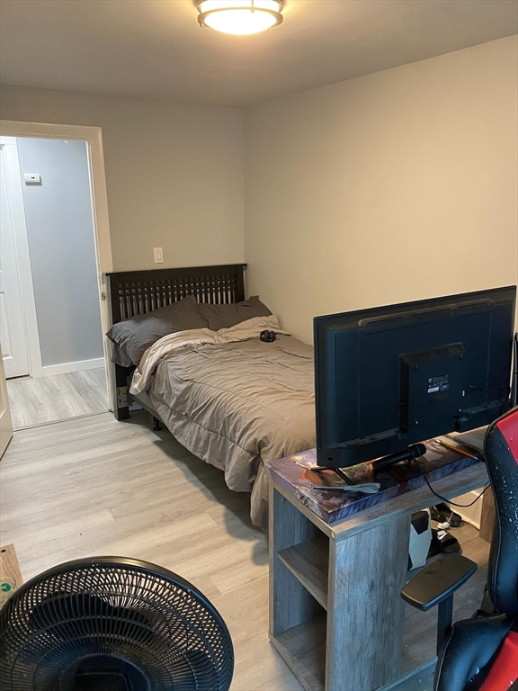 368 Globe Street Fall River, MA 02724 - Photo 21 of 31 a bedroom with a bed and a flat screen tv