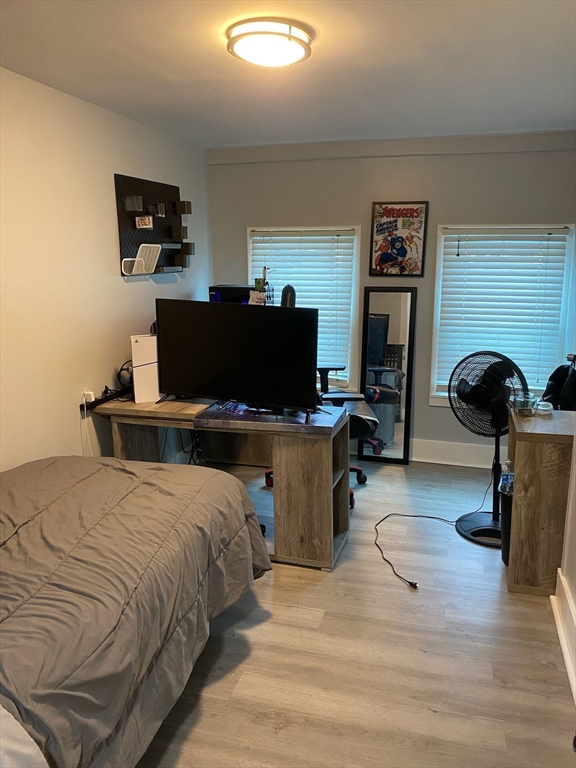 368 Globe Street Fall River, MA 02724 - Photo 22 of 31 a bedroom with a bed and a computer on a desk next to a window