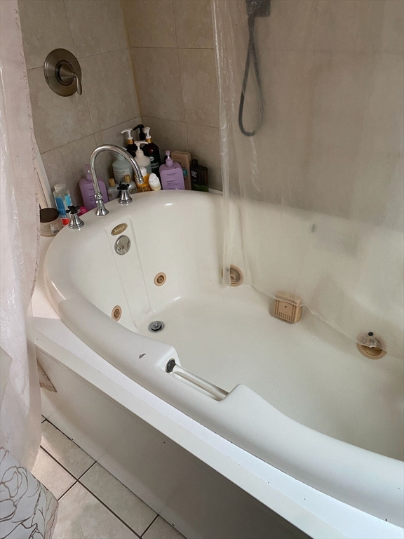 368 Globe Street Fall River, MA 02724 - Photo 23 of 31 a bathroom with a tub