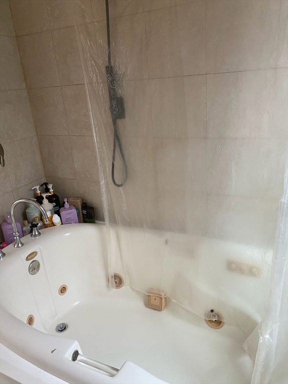 368 Globe Street Fall River, MA 02724 - Photo 24 of 31 a bathroom with a tub