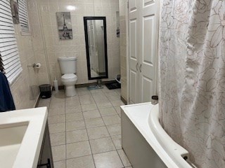 368 Globe Street Fall River, MA 02724 - Photo 26 of 31 a bathroom with a bathtub and a toilet