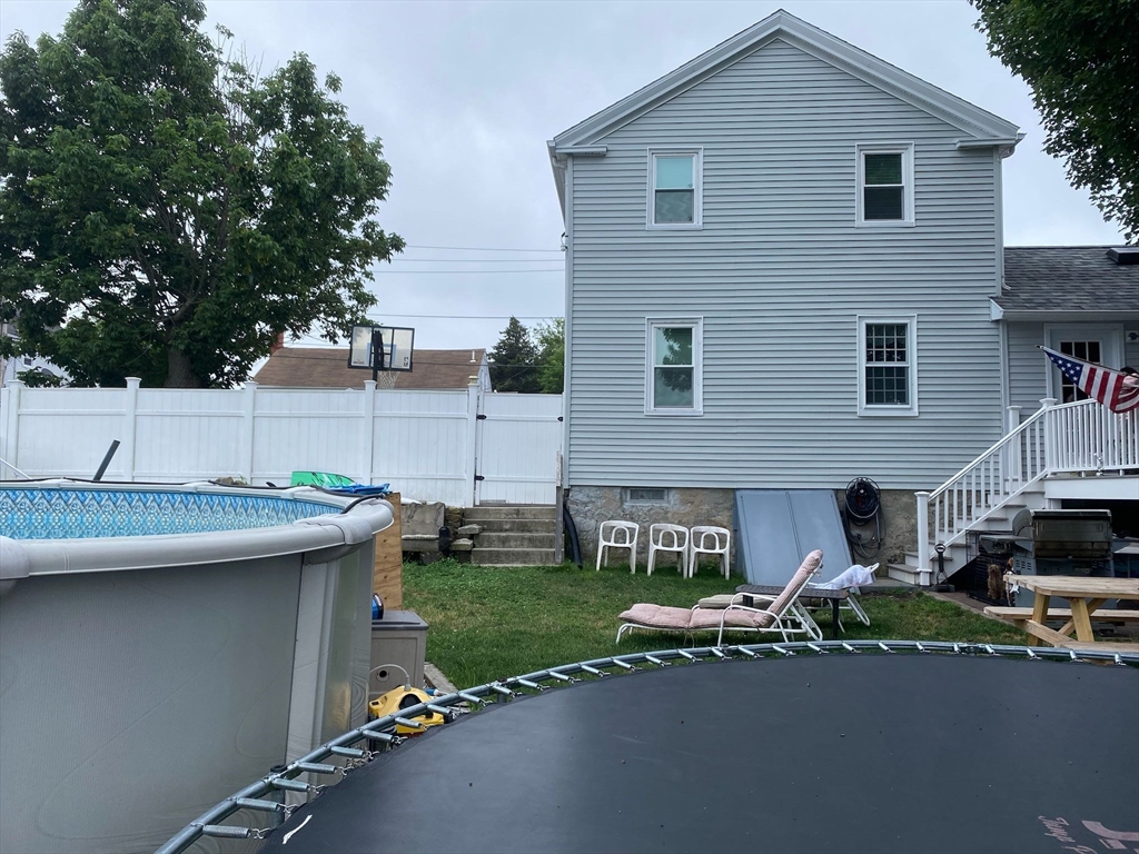 368 Globe Street Fall River, MA 02724 - Photo 3 of 31 a view of a house with a patio and a yard