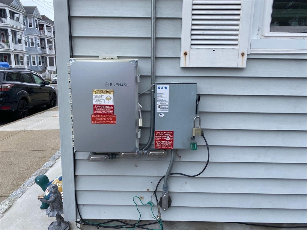368 Globe Street Fall River, MA 02724 - Photo 31 of 31 a bathroom with a bathtub and cabinets