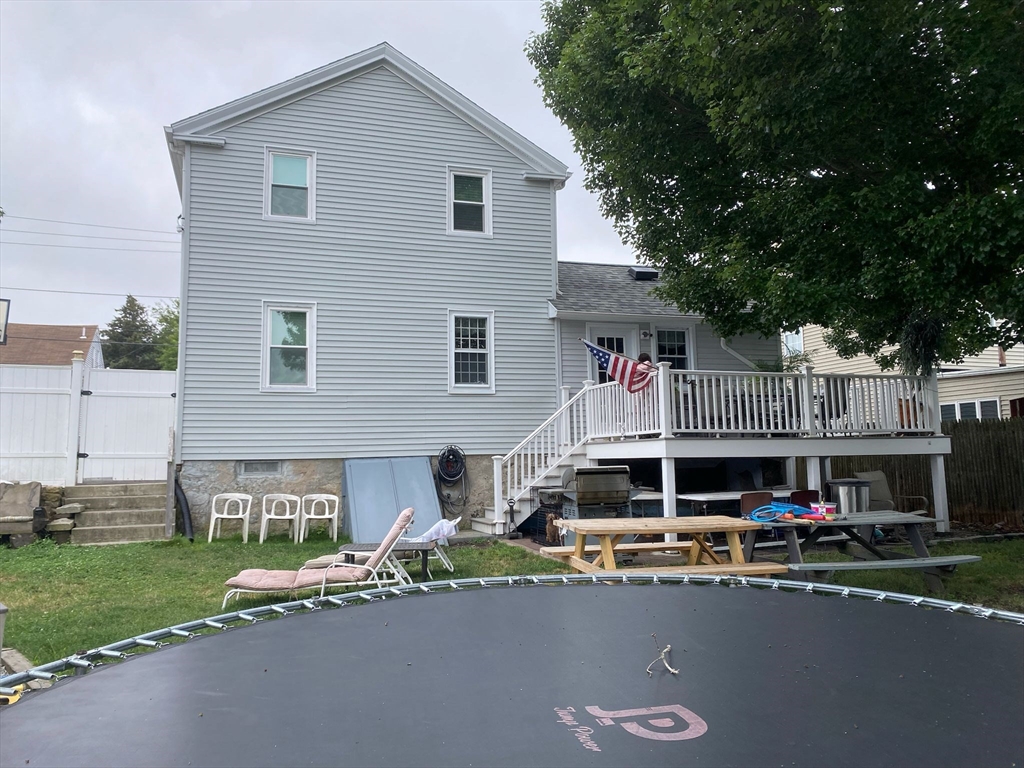368 Globe Street Fall River, MA 02724 - Photo 4 of 31 a front view of a house with a garden and sitting area