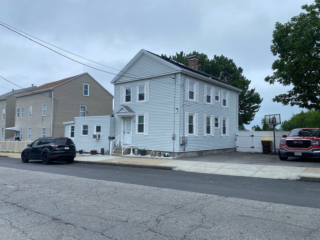 368 Globe Street Fall River, MA 02724 - Photo 6 of 31 a car parked in front of a house