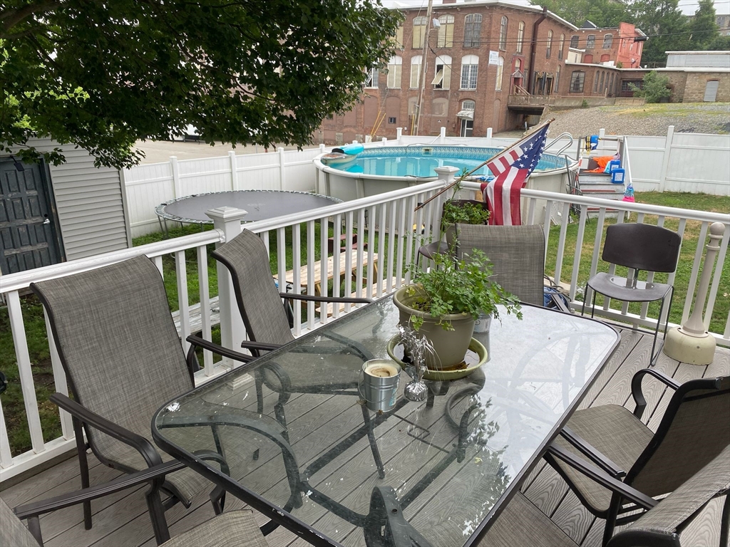 368 Globe Street Fall River, MA 02724 - Photo 9 of 31 a balcony with table and chairs