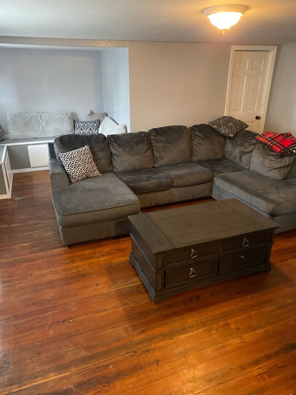 368 Globe Street Fall River, MA 02724 - Photo 10 of 31 a living room with furniture and a wooden floor
