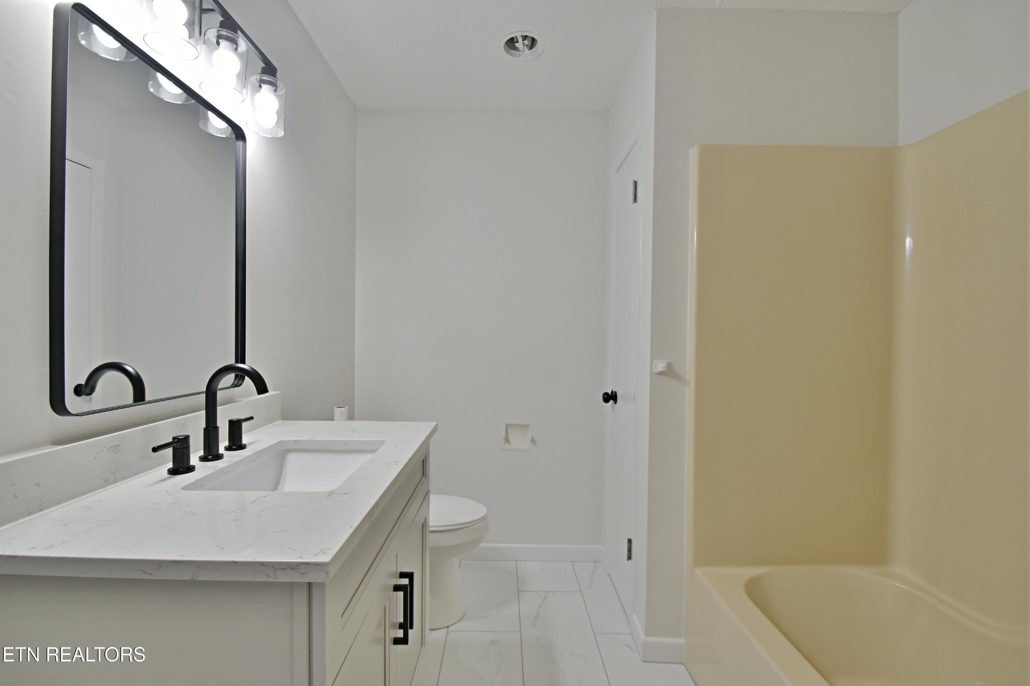 1119 Rudd Road Greenback, TN 37742 - Photo 19 of 28 a bathroom with a sink and a mirror