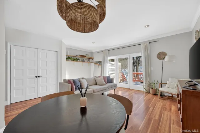 a dining room with furniture and wooden floor