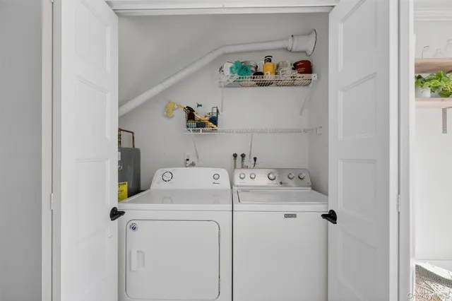 a kitchen with granite countertop a stove top oven a sink dishwasher a dining table and chairs with wooden floor