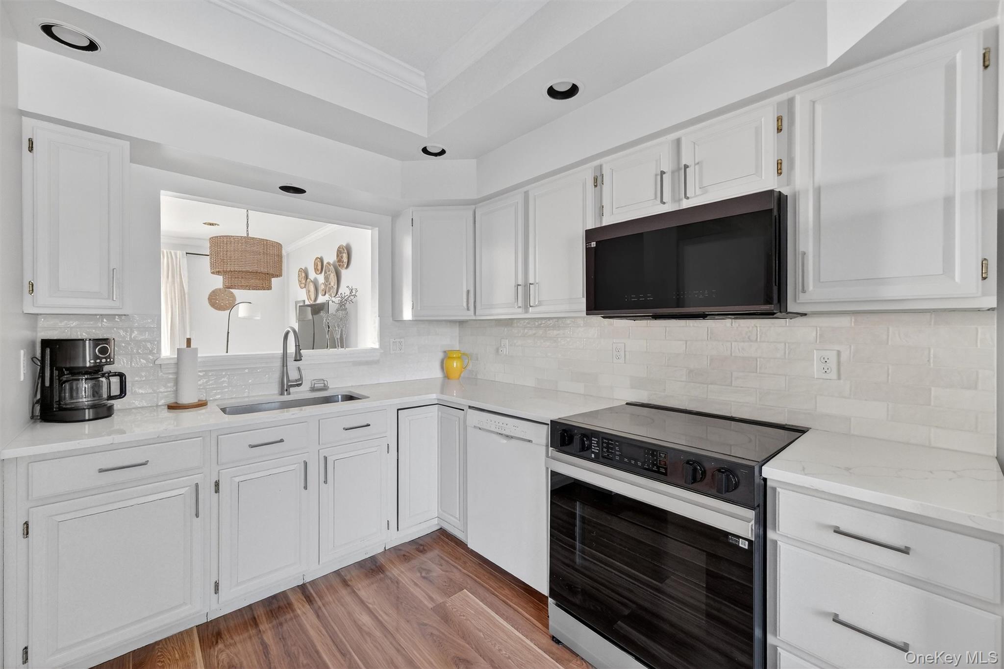 90 Roundtree Court Beacon, NY 12508 - Photo 15 of 39 a kitchen with cabinets stainless steel appliances a sink and a window