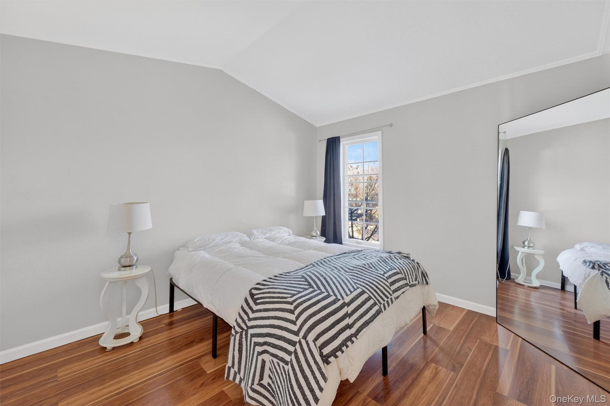 90 Roundtree Court Beacon, NY 12508 - Photo 23 of 39 a bedroom with a bed and wooden floor