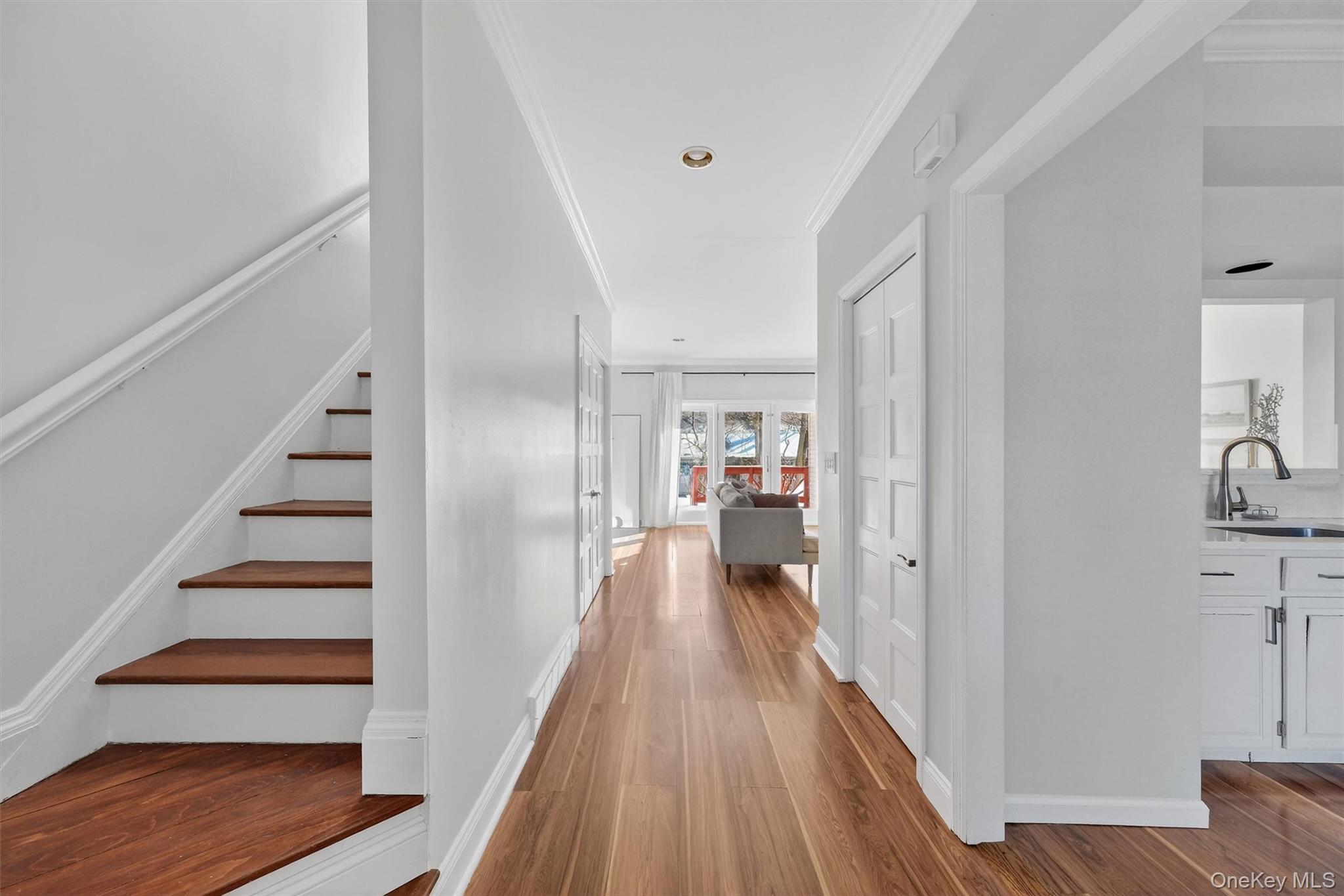 90 Roundtree Court Beacon, NY 12508 - Photo 6 of 39 a view of a hallway with wooden floor and staircase