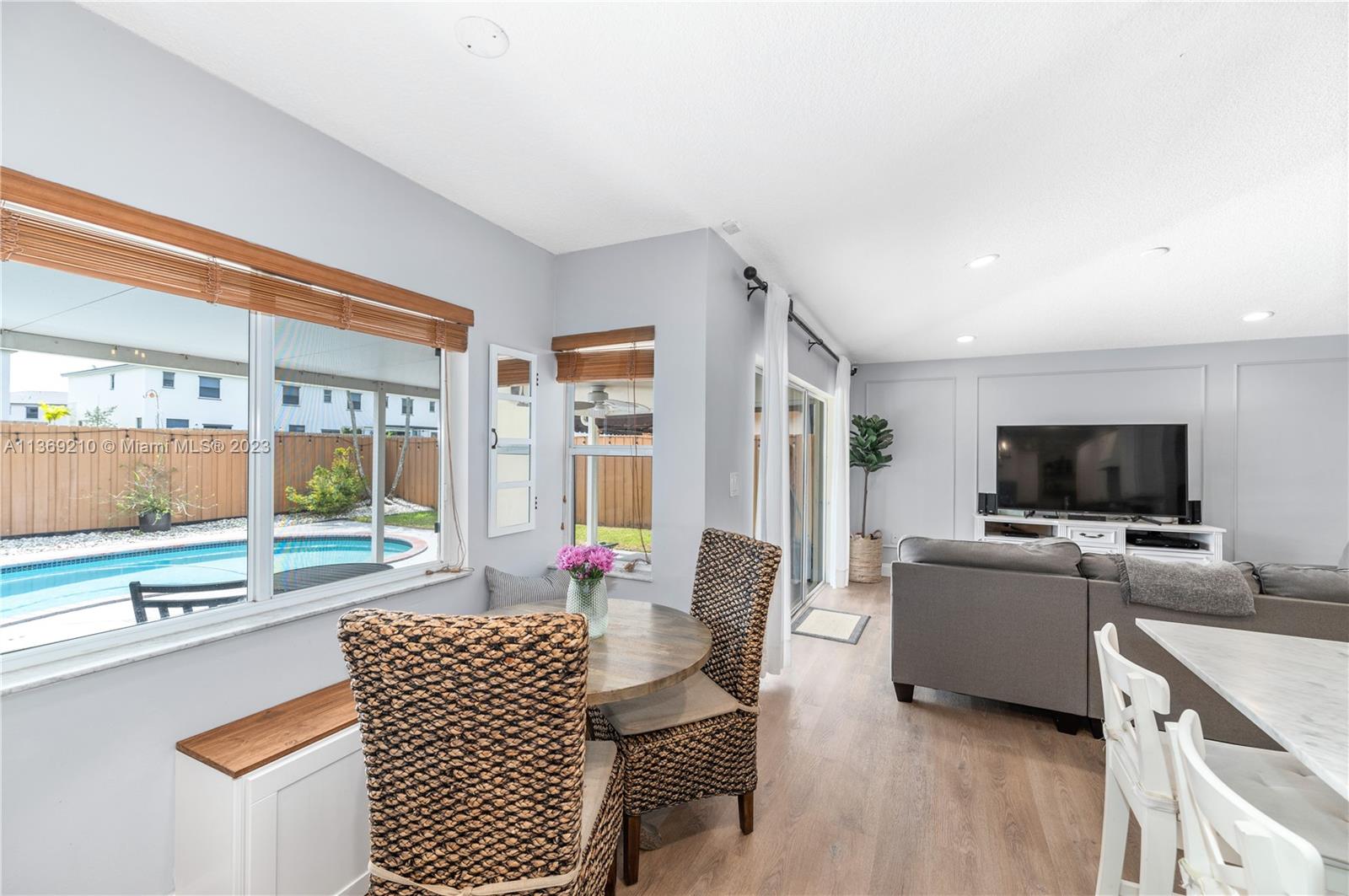 18217 Southwest 148th Ave Road Miami, FL 33187 - Photo 13 of 29 a living room with furniture and a flat screen tv