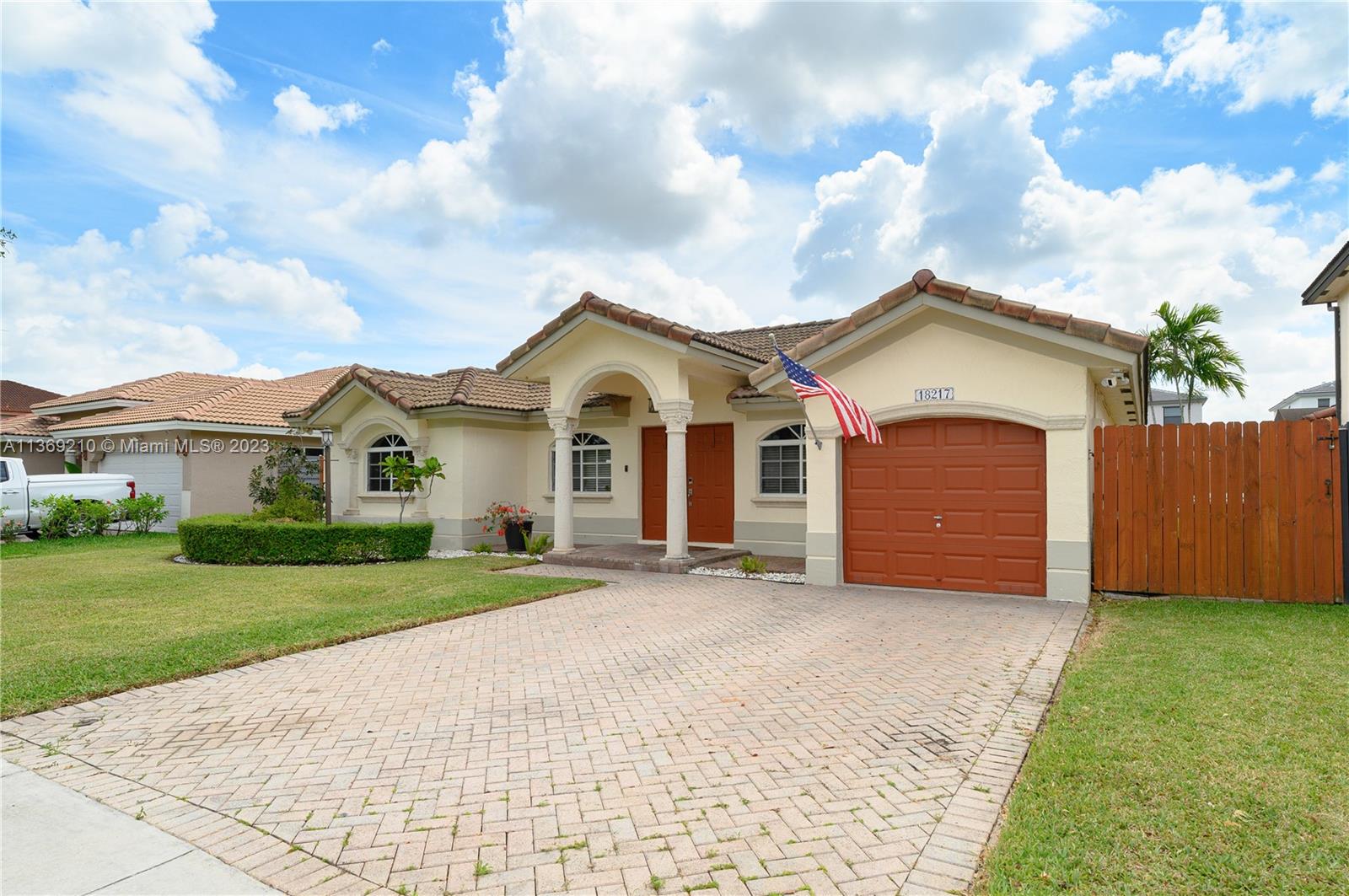 18217 Southwest 148th Ave Road Miami, FL 33187 - Photo 2 of 29 a view of house with yard and green space