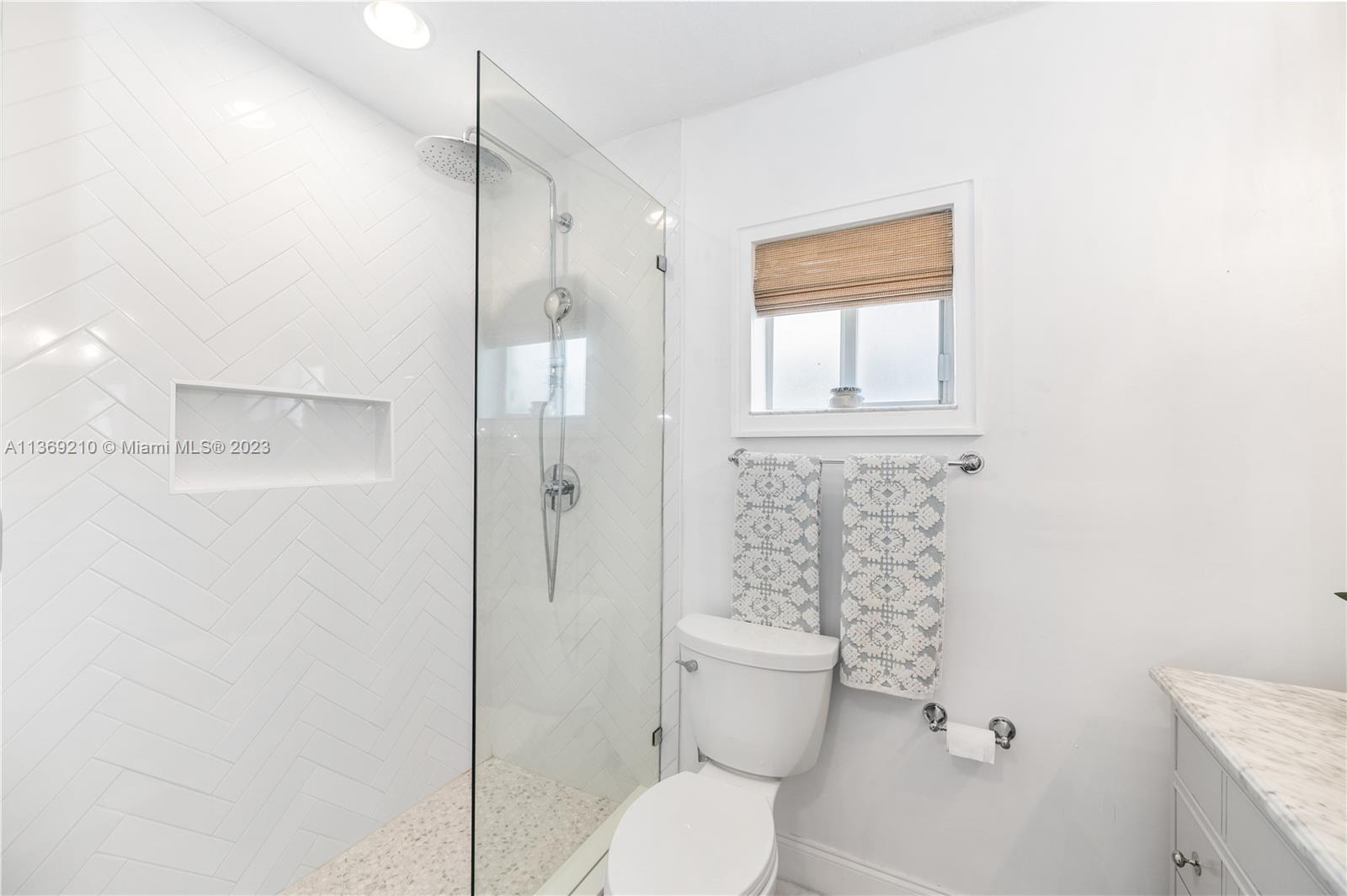 18217 Southwest 148th Ave Road Miami, FL 33187 - Photo 22 of 29 a bathroom with a toilet and a shower