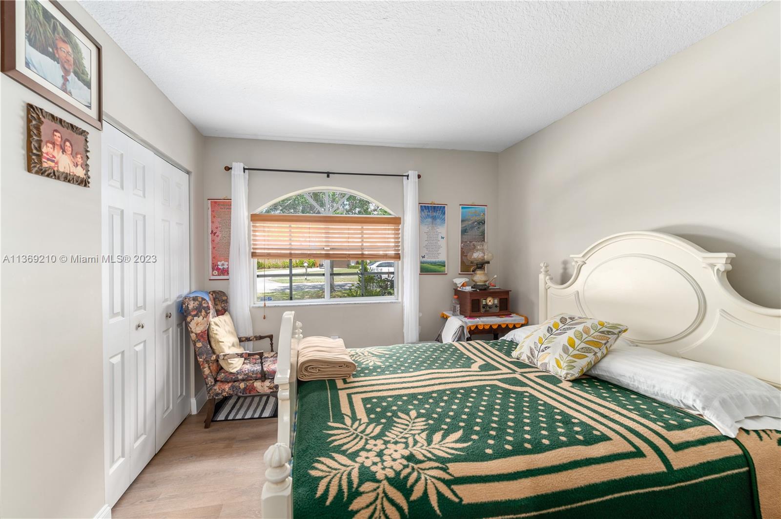 18217 Southwest 148th Ave Road Miami, FL 33187 - Photo 23 of 29 a bedroom with a bed and a window