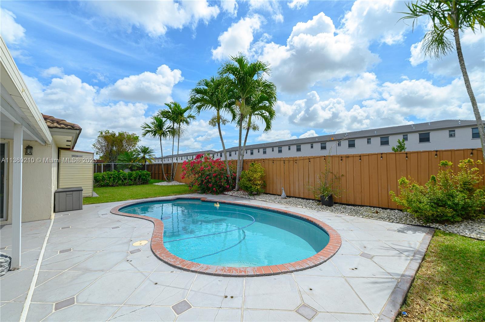 18217 Southwest 148th Ave Road Miami, FL 33187 - Photo 27 of 29 a view of outdoor space and swimming pool