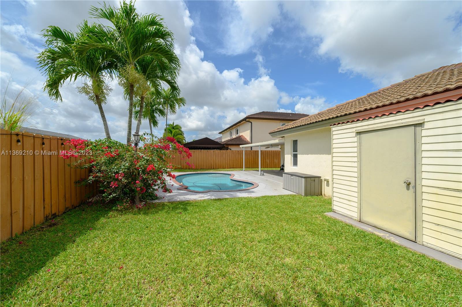 18217 Southwest 148th Ave Road Miami, FL 33187 - Photo 29 of 29 a view of a back yard of the house