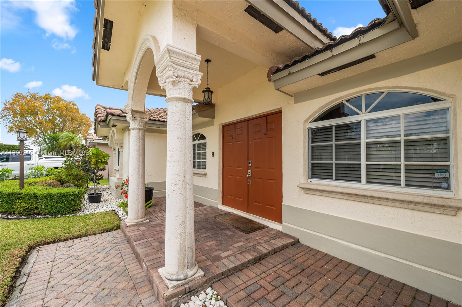 18217 Southwest 148th Ave Road Miami, FL 33187 - Photo 3 of 29 a front view of a house with a yard