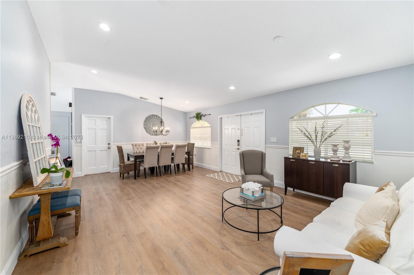 18217 Southwest 148th Ave Road Miami, FL 33187 - Photo 6 of 29 a living room with furniture and a large window