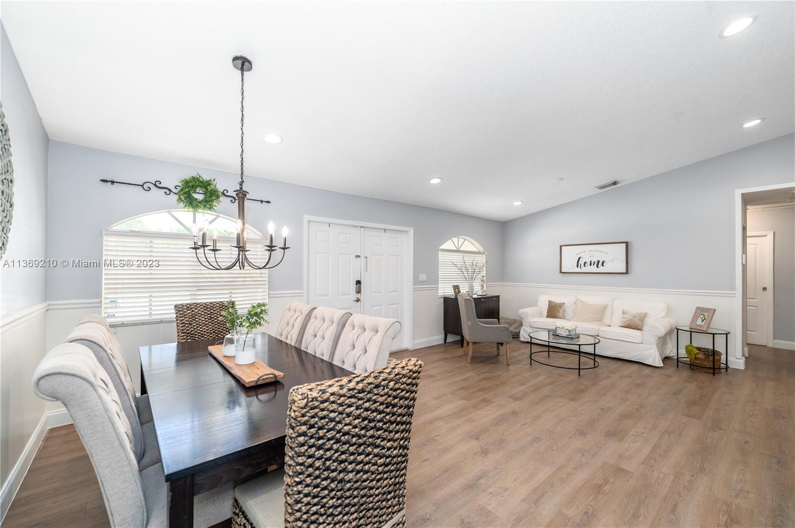 18217 Southwest 148th Ave Road Miami, FL 33187 - Photo 7 of 29 a living room with furniture and a wooden floor