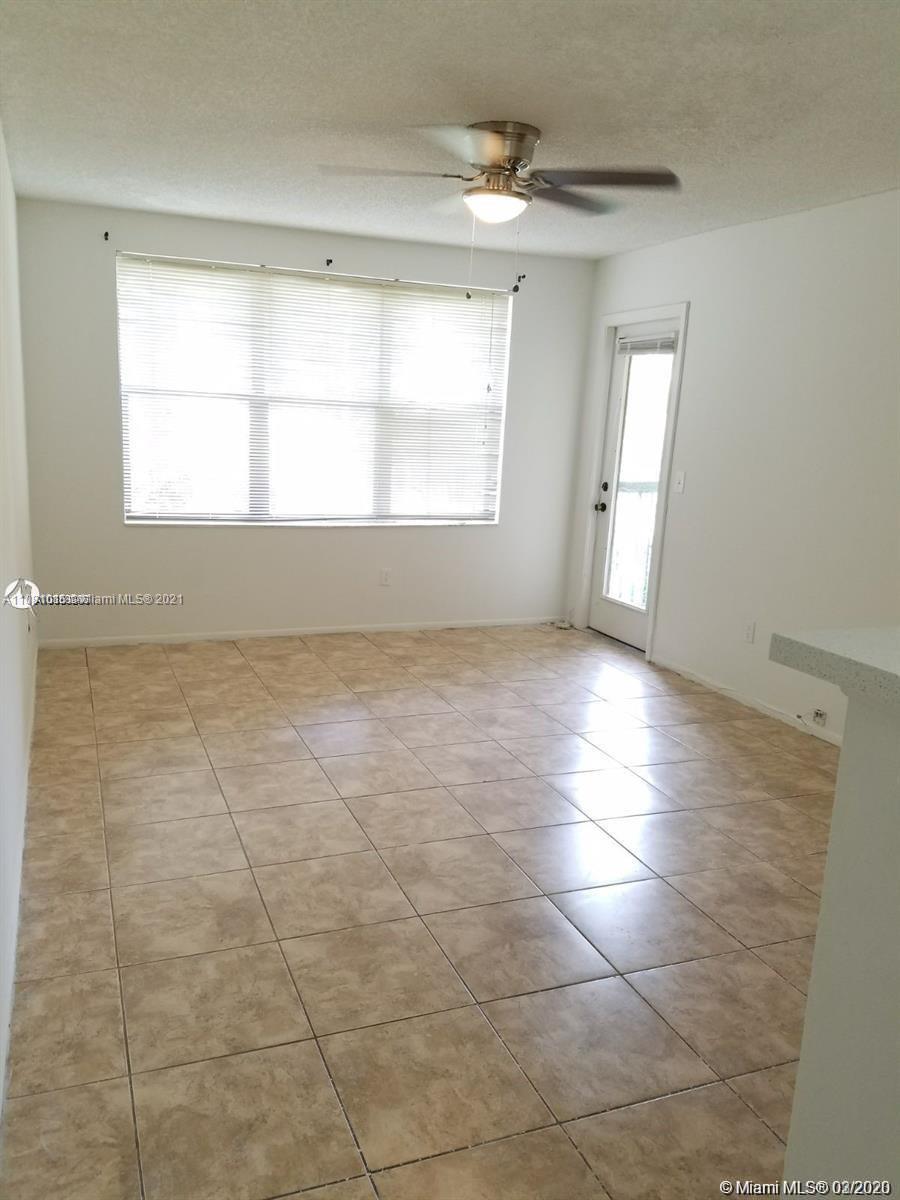 4581 West McNab Road, Unit 14 Pompano Beach, FL 33069 - Photo 7 of 10 a view of an empty room and window