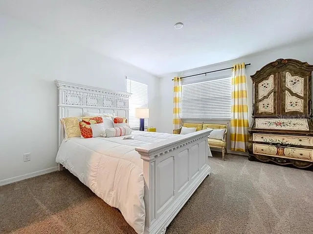 a bed room with a bed and a night stand