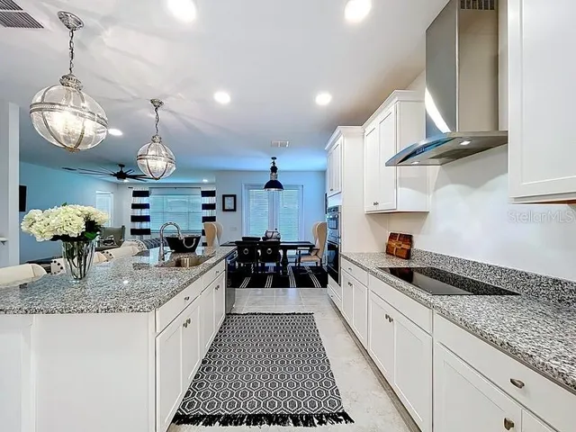 a kitchen with granite countertop lots of counter top space