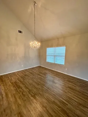a bathroom with a sink a toilet a mirror and vanity