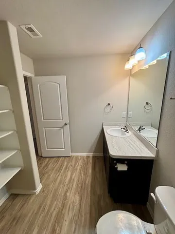a bathroom with a bathtub and a sink