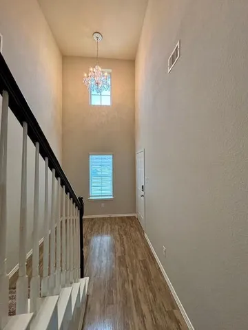 a view of entryway with wooden floor